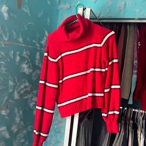 red loose turtle neck sweater.